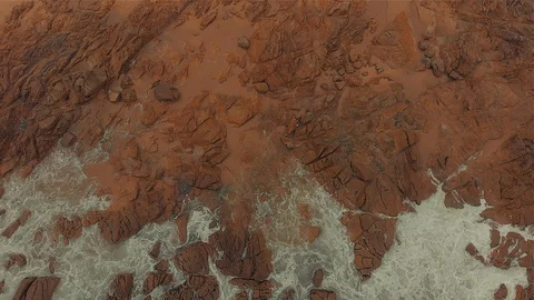 4K Aerial Top Down of Waves Crushing on Rocks Stock Footage