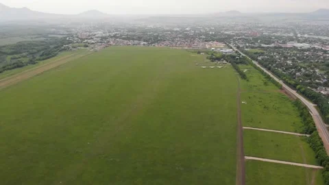 4k Aerial top view of a field airfield with standing planes, along road or city Stock-Footage 147460853