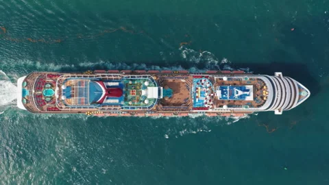 4K aerial top view of luxury large cruise ship with the water park is sailing Stock Footage 134285524