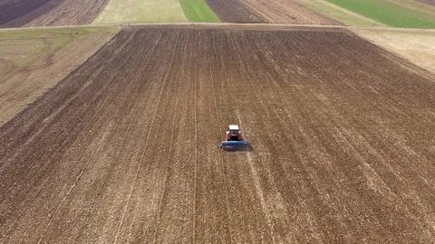 4k Aerial top view of a tractor, combine... | Stock Video | Pond5