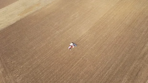 4k Aerial top view of a tractor, combine... | Stock Video | Pond5