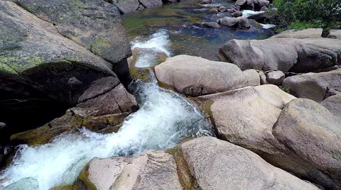 4k Aerial tracking view going down a rocky stream Yosemite National Park Stock Footage 66561593