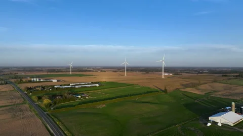 A 4K aerial video, looking at a rural landscape with a trio of wind turbines. 库存影片 201752953