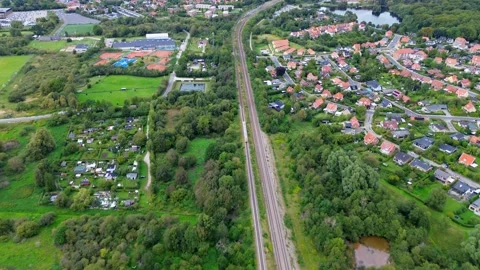 4k aerial video of a train traversing a town in Denmark Video stock 288632083