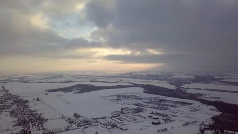 4k aerial video. Winter landscape on the village and river. Warm sunset light. Stock Footage