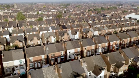4K aerial view above rows of back to back terraced houses in England Video stock 249614702