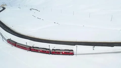 4K Aerial View Bernina Express Swiss Alps Railway Bernina Pass Winter Stockbeeldmateriaal 339267645