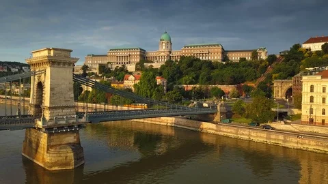4K aerial view of Buda Castle Royal Palace at sunrise with yellow tram Stock Footage 90906034