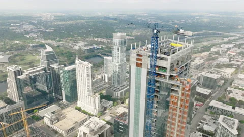 4K aerial view on building construction with beautiful Austin city view Texas 4K Stock Footage 239775566