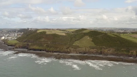 4K Aerial view of cliff side beach in Devon Stock Footage 126698075