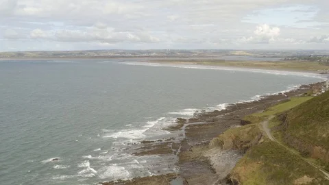 4K Aerial view of Devon Beach and Hillside Stock Footage 126698947