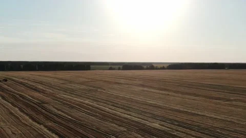 4k Aerial view from the drone to a combine agriculture machine harvesting golden Stock Footage 158171696