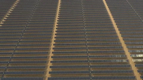 4K Aerial view from a drone flying over a solar farm in a desert. Stock Footage 131364100
