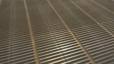 4K Aerial view from a drone flying over a solar farm in a desert. Stock Footage 131364110