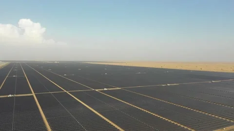 4K Aerial view from a drone flying over a solar farm in a desert. Stock Footage 131364152