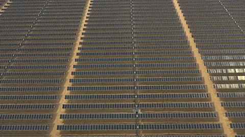 4K Aerial view from a drone flying over a solar farm in a desert. Stock Footage 131364221