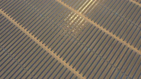 4K Aerial view from a drone flying over a solar farm in a desert. Stock Footage 131364375