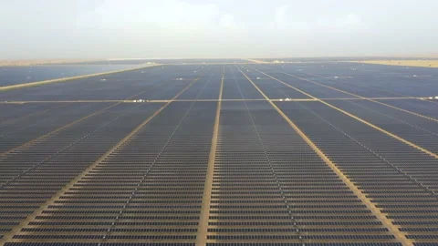 4K Aerial view from a drone flying over a solar farm in a desert. Stock Footage 131364388