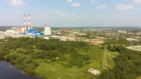 4K aerial view of the electrical power station and working village Yaiva Stock Footage 113338282