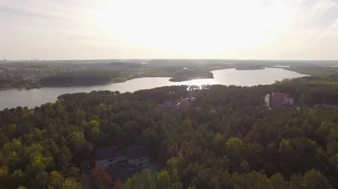 4K aerial view – flight over river valley with houses and forest near Stock Footage 56165129