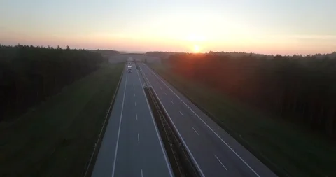 4k aerial view flight over highway in countryside cars trucks lorry moving  Stock Footage 93374280