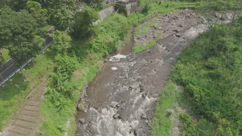 4K Aerial view fly over rocks mountain rivers beside the Ngantang Pujon Road Stock Footage 273337917