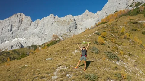 4K Aerial View Flying fast at Woman in Mountains Stock Footage 119002004