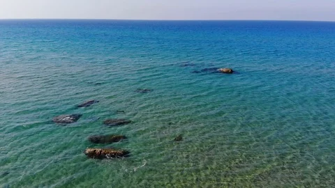 4k aerial view flying forward over transparent green turquoise crystal water Stock Footage 105264995