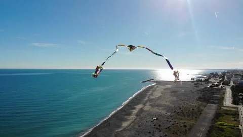 4K Aerial view of flying kite filmed by a drone in mid air - Medium long shot .- Stock Footage 102086554