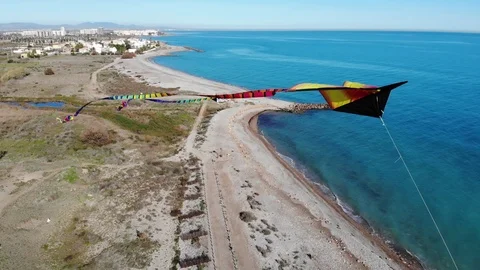 4K Aerial view of flying kite filmed by a drone in mid air - Medium long shot .- Stock-Footage 102087948