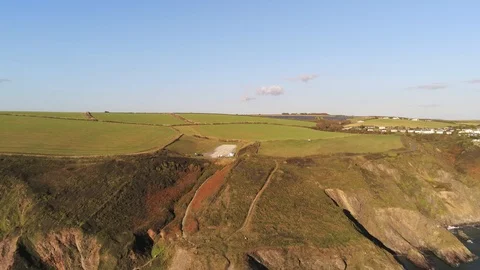 4K Aerial View Flying In Reverse To Reveal Cliffs Stock Footage 115939633