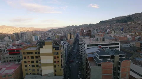 4K aerial view forward between buildings downtown la paz bolivia Vídeo Stock 64786520