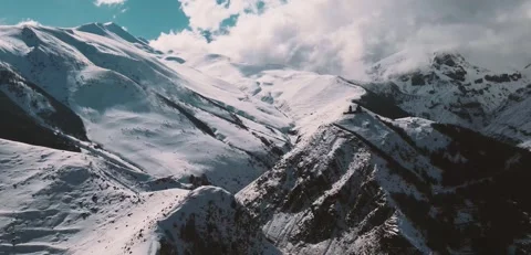 4K Aerial View Gergeti Trinity Church Snow Covered Caucasus Mountains Stock-Footage 334449496