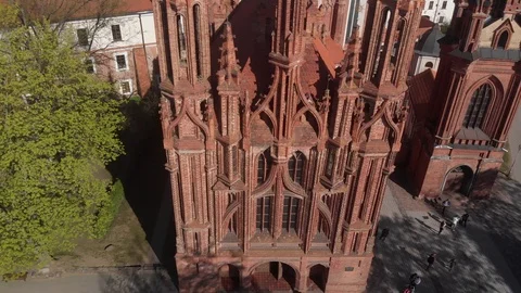 4k aerial view of gothic architecture heritage St. Anne's church in Vilnius Stock Footage 112418225