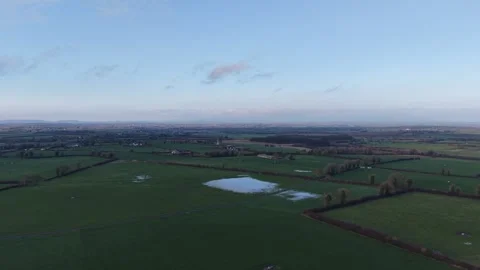 4K Aerial View of Green Fields with Waterlogged Patch 스톡 동영상 332802813