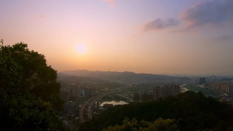 4K aerial view of highway bridge with traffic cars and sunset of Taipei city-Dan Stock Footage 87387475