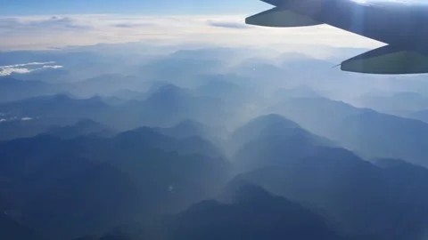 4K Aerial View Layered Mountain Range With Mist And Haze From Airplane Stock-Footage 334448224