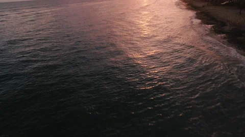 4K Aerial View:  Looking Down on Red Water/Sunset Stock Footage 68002368
