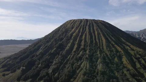 4K Aerial view of mountain next to valley, Mount Batok, Bromo Indonesia Stock Footage 200871971