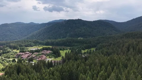 4K Aerial View of Mountain Resort and Lakes in Pine Forest Stock Footage 345329845