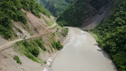 4K Aerial view of mountain river with brown water in Gulmi Nepal Stock Footage 156965007