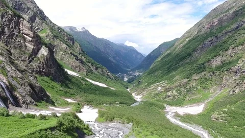 4K Aerial view . Mountain stream and waterfalls between the mountains Stock Footage 73423989