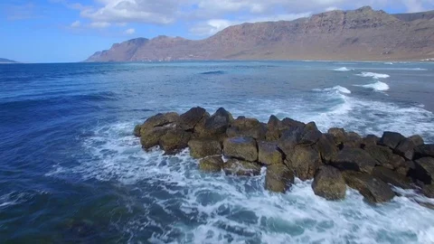 4K Aerial view of ocean waves near Mirador Del Rio Cliffs, Lanzarote Stock Footage 123470037