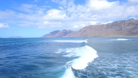 4K Aerial view of ocean waves in sunny Lanzarote - Mirador del Rio Cliffs Stock Footage 123470062