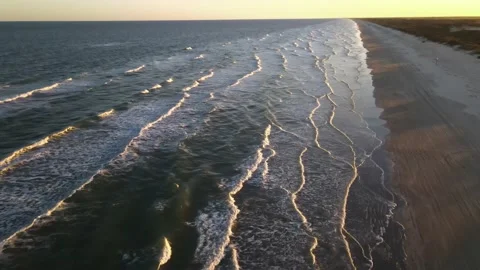 4K Aerial View of Ocean Waves and Beach. Sunset. Dolly Shot Stock Footage 146172027