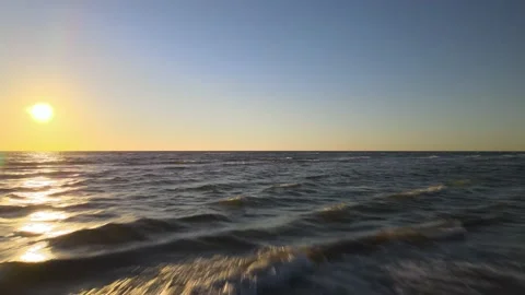 4K Aerial View of Ocean Waves Sunrise. Dolly Shot. Fast Stock Footage 146175956