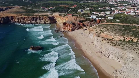 4K aerial view ocean waves rocky, cliffs  coast, beach Sagres Algarve Portugal Stock Footage 240659425