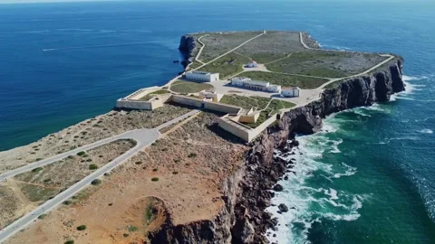 4K aerial view ocean waves rocky, Sagres Fortress Sagres Point  Algarve Portugal Stock Footage 240659503