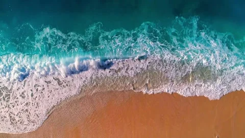 4K Aerial View of Ocean Waves Breaking and Crashing on Sandy Beach Stock Footage 328535729