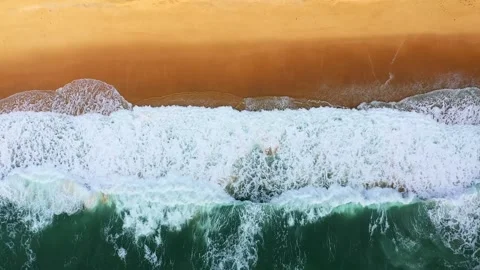 4K Aerial View Ocean Waves Crashing On Golden Sand Beach Drone Shot Video stock 334447054